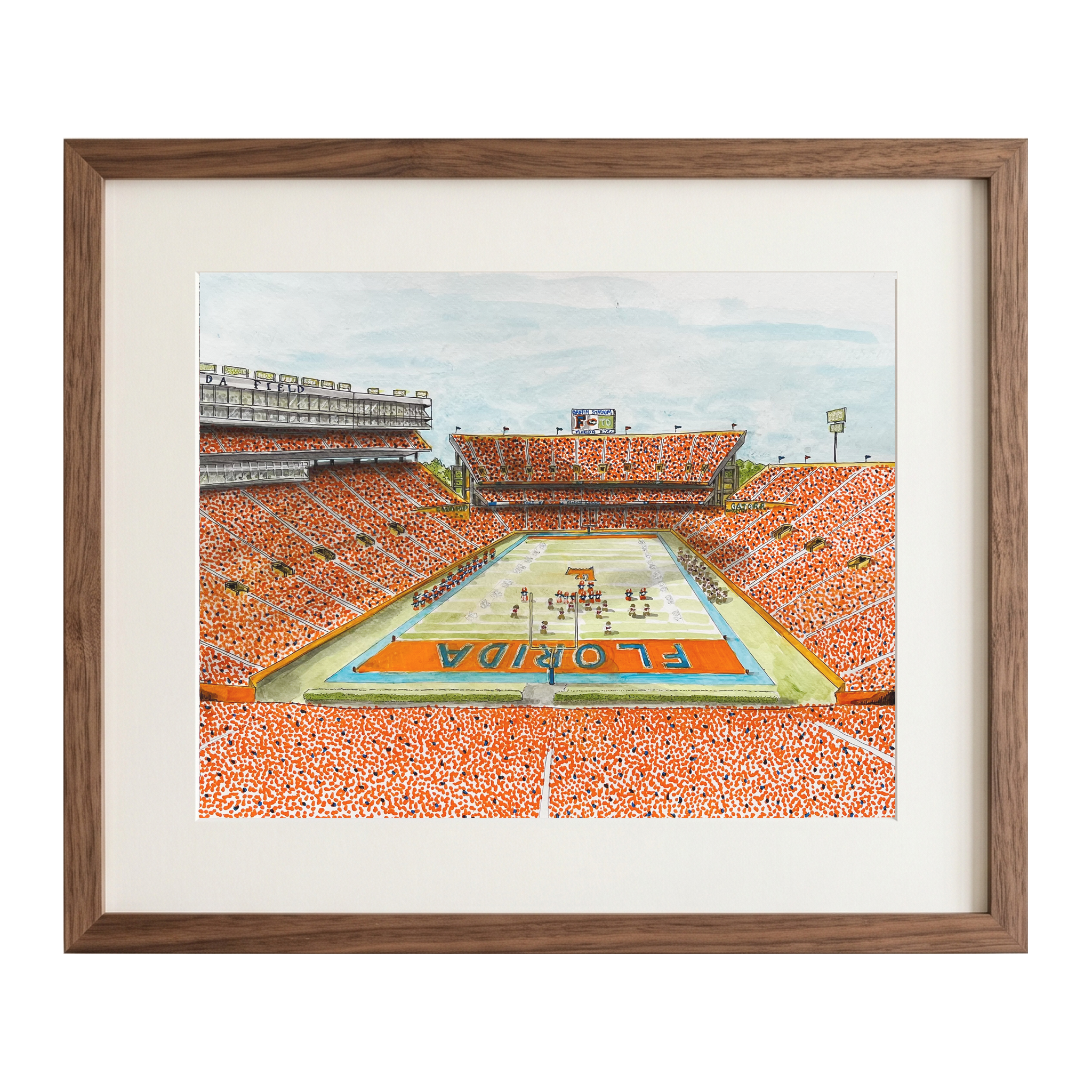 A framed watercolor painting of a packed football stadium with 'Florida' written on the field, shown against a plain white background.